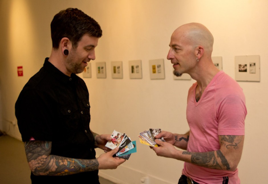 The organizers trade cards before the show